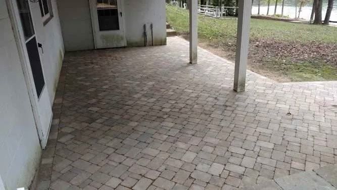 Paver patio beside a lake