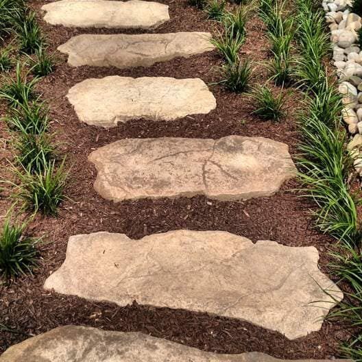 Stone stepping-stone walkway through grasses