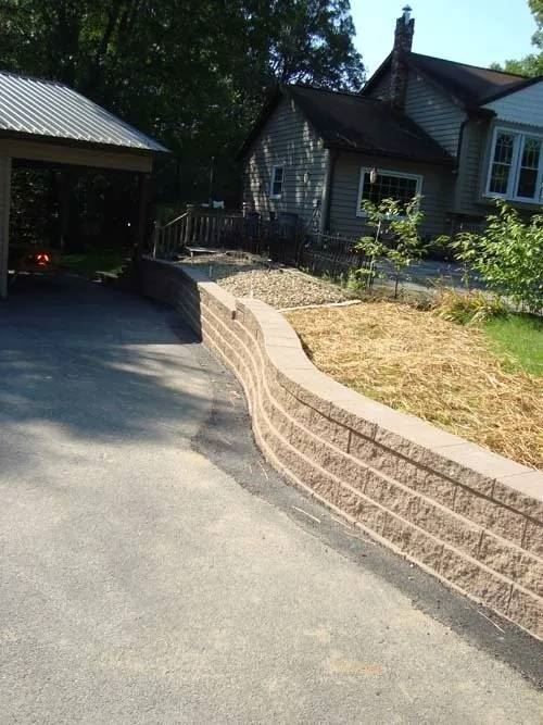 Tiered retaining wall along a driveway